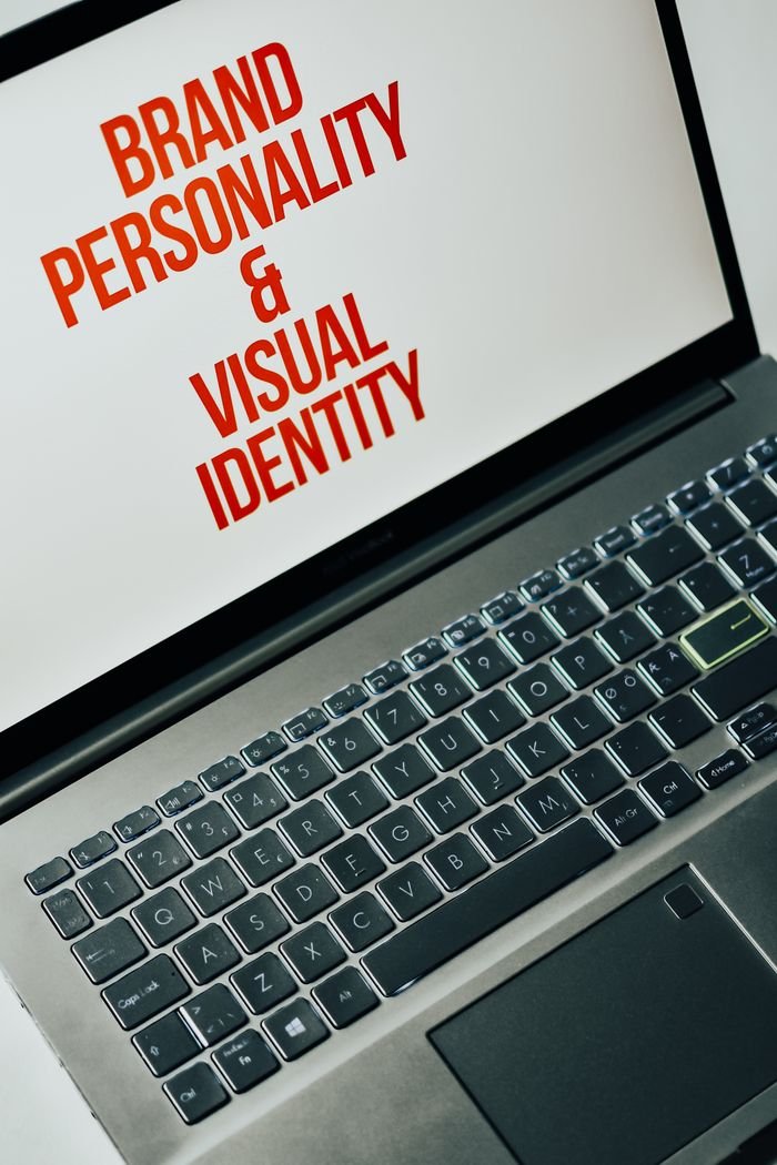 About Laptop screen showing text on brand personality and visual identity for marketing strategy.