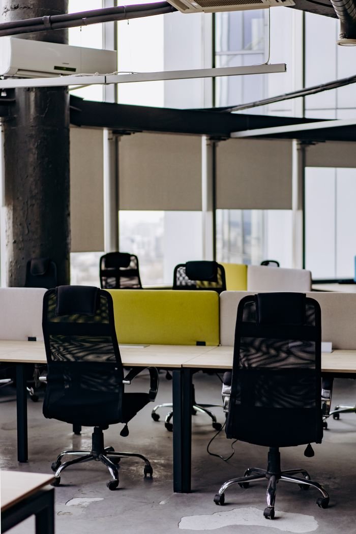 Services Contemporary office space with sleek furniture, ideal for teamwork and productivity.
